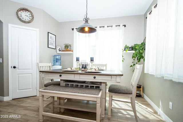 dining area with light wood-type flooring