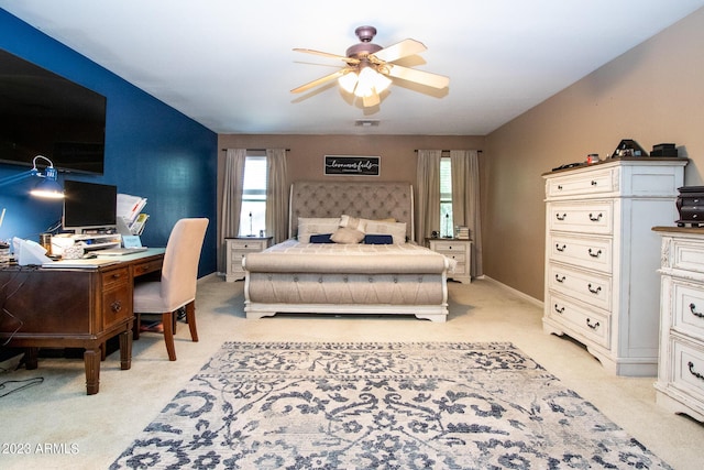 bedroom featuring ceiling fan and multiple windows