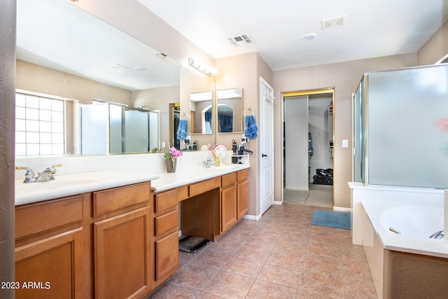 bathroom with vanity, tile patterned floors, and shower with separate bathtub