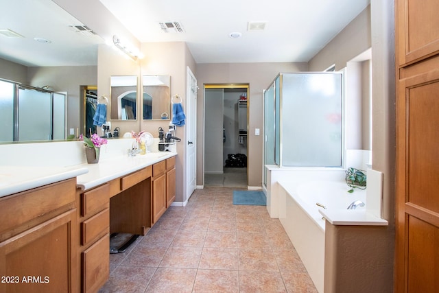 bathroom featuring tile patterned flooring, vanity, and plus walk in shower