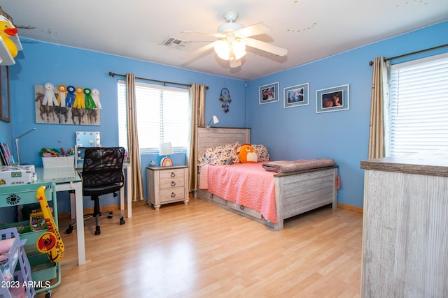 bedroom featuring light hardwood / wood-style flooring and ceiling fan