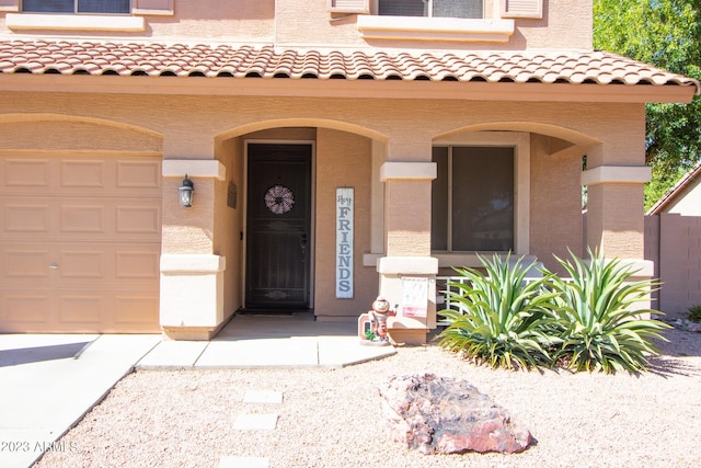 doorway to property featuring a garage