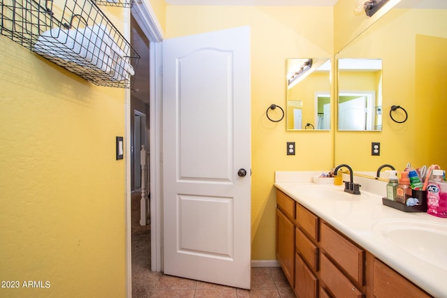 bathroom with tile patterned floors and vanity