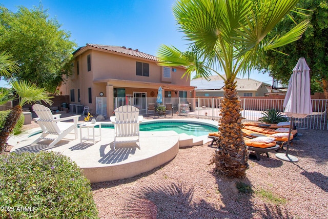 view of swimming pool with a patio area