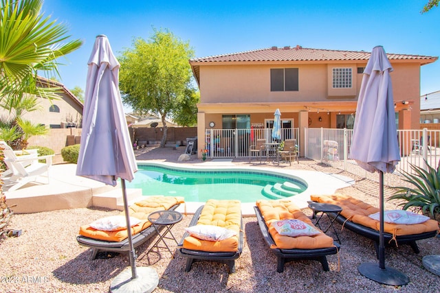 view of swimming pool featuring a patio area