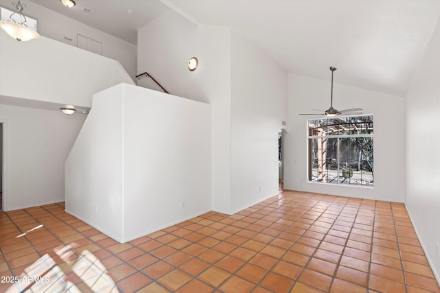 unfurnished room with ceiling fan, high vaulted ceiling, and tile patterned flooring
