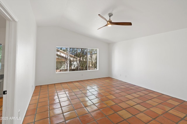 tiled spare room featuring ceiling fan and lofted ceiling