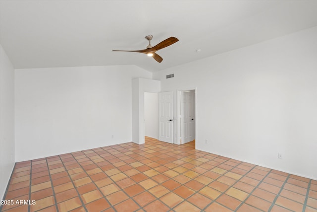 unfurnished room featuring lofted ceiling, a ceiling fan, and visible vents