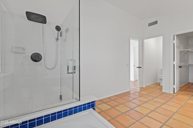 full bath featuring tile patterned floors, toilet, a washtub, a shower stall, and visible vents
