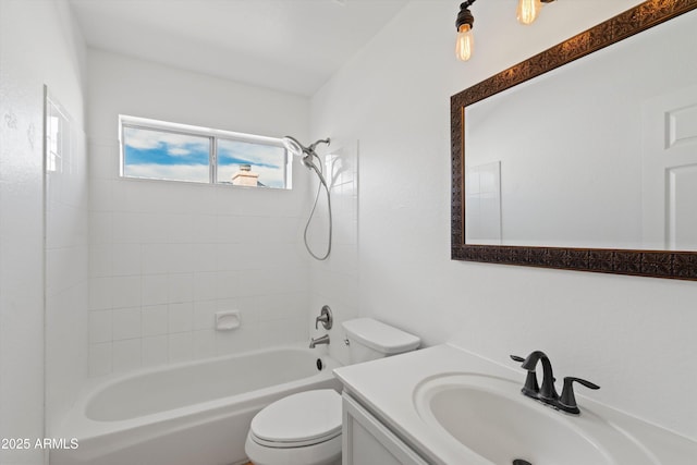 bathroom featuring washtub / shower combination, toilet, and vanity