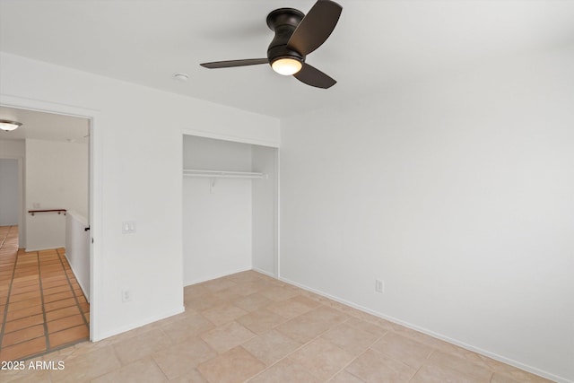 unfurnished bedroom featuring a closet, baseboards, and ceiling fan