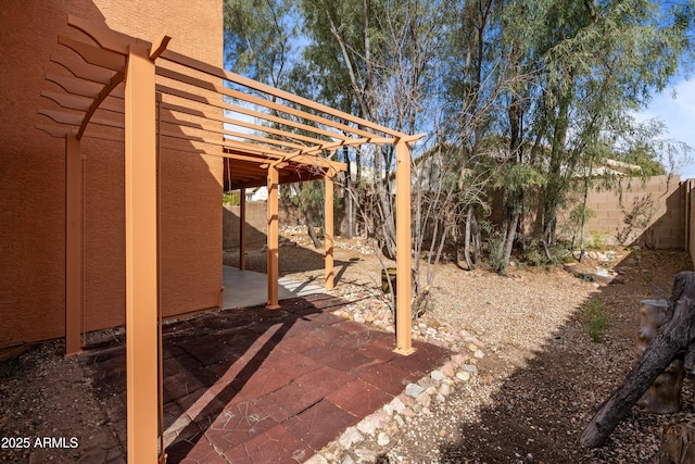 view of yard featuring a fenced backyard, a patio, and a pergola