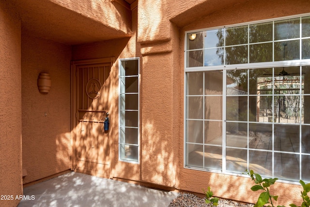 view of side of home featuring stucco siding