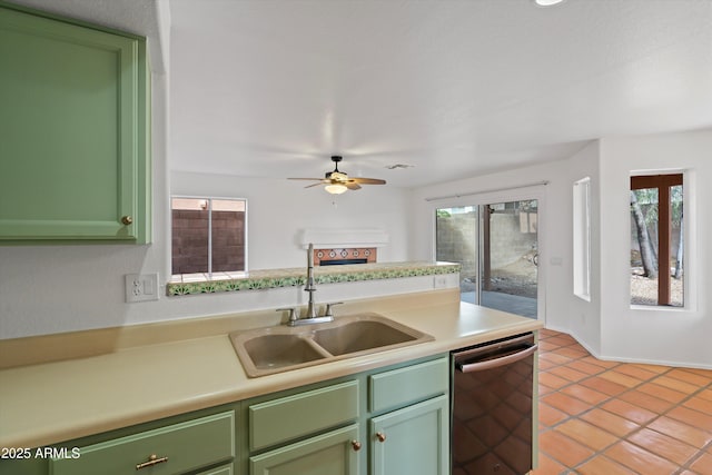 kitchen with ceiling fan, green cabinets, dishwasher, and a sink