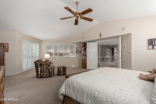 carpeted bedroom featuring vaulted ceiling, baseboards, and a ceiling fan