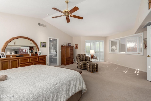 bedroom with vaulted ceiling, light carpet, baseboards, ensuite bathroom, and a ceiling fan