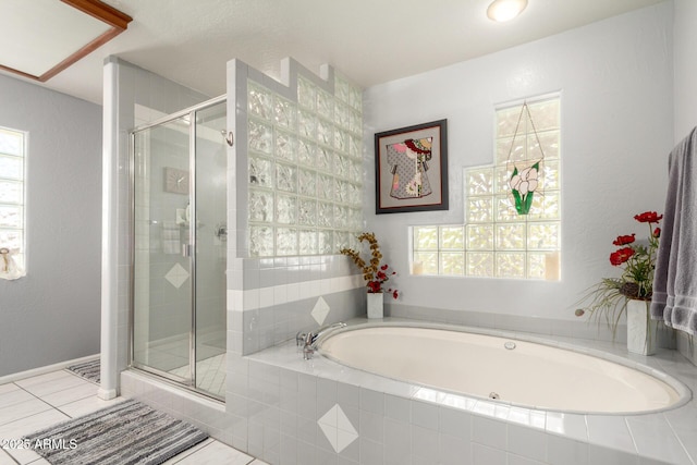 full bathroom featuring a stall shower, a bath, and tile patterned flooring