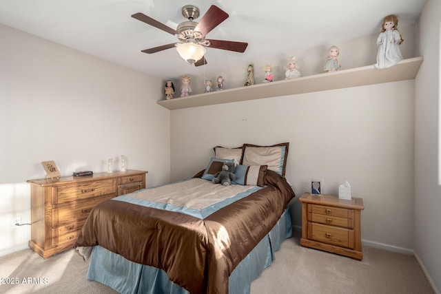 bedroom with light carpet, a ceiling fan, and baseboards