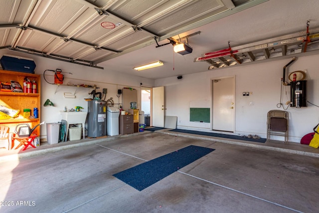 garage with water heater and a garage door opener