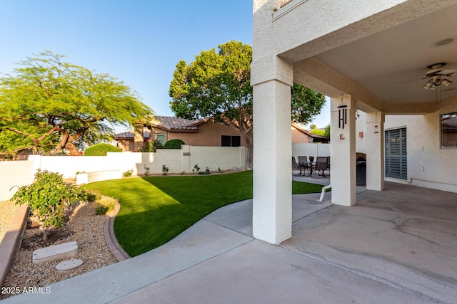 view of patio featuring ceiling fan
