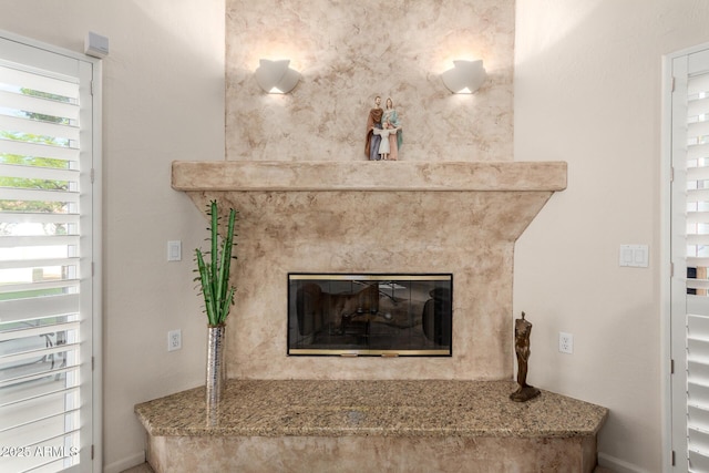 detailed view of a premium fireplace and baseboards