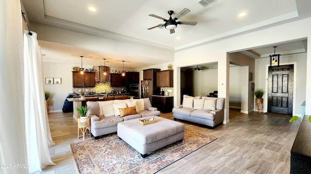 living room featuring ceiling fan