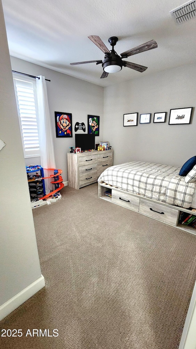 carpeted bedroom with ceiling fan