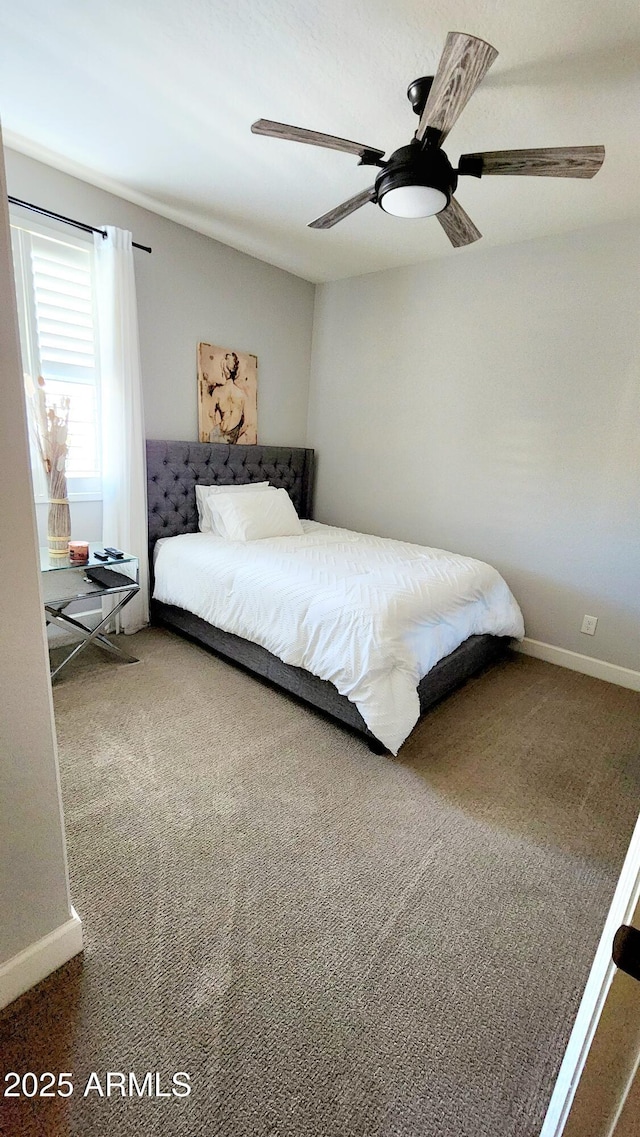 bedroom featuring ceiling fan and carpet flooring