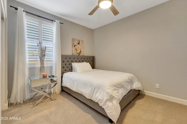 bedroom with ceiling fan and light colored carpet