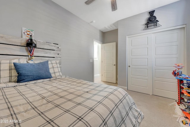 carpeted bedroom featuring a closet and ceiling fan