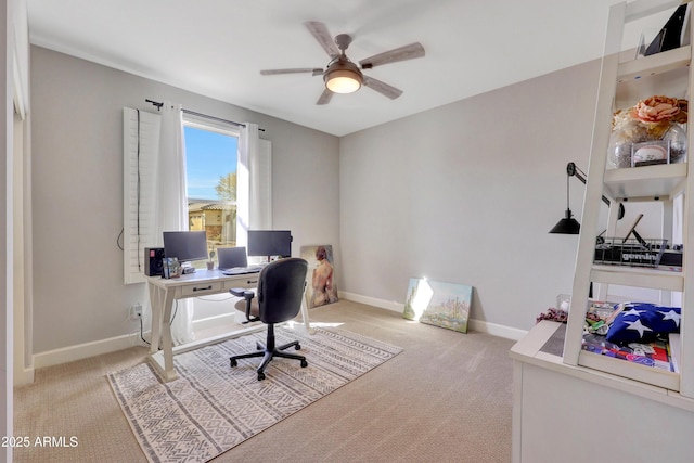 office area featuring ceiling fan and light carpet