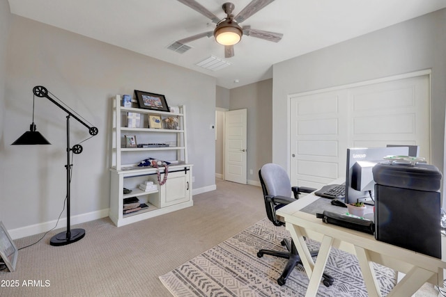 carpeted office featuring ceiling fan