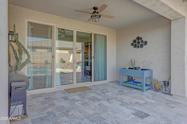 view of patio with ceiling fan