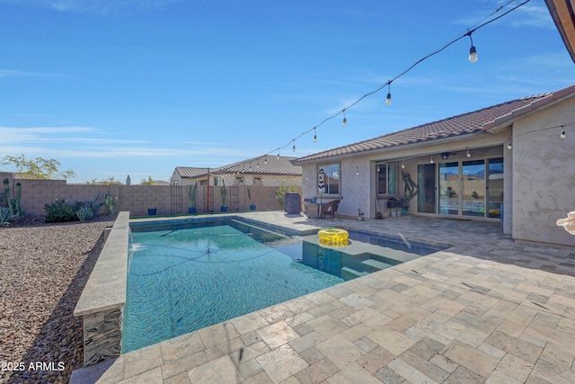 view of swimming pool with a patio area