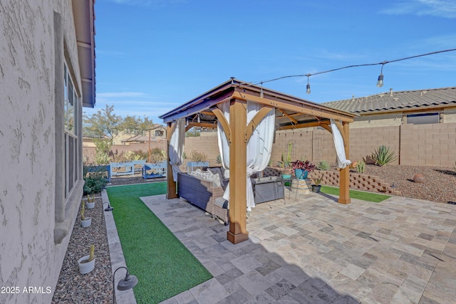 view of patio with an outdoor hangout area and a gazebo