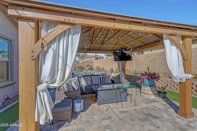 view of patio featuring a gazebo and outdoor lounge area