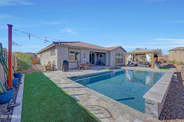 view of swimming pool with a patio area, a gazebo, and a lawn