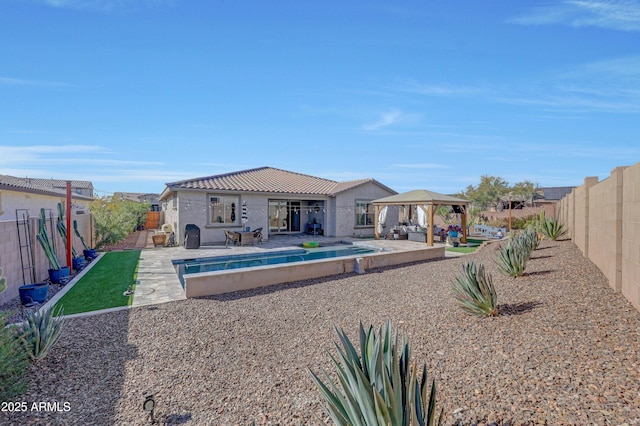 back of house with a patio, a gazebo, and an empty pool