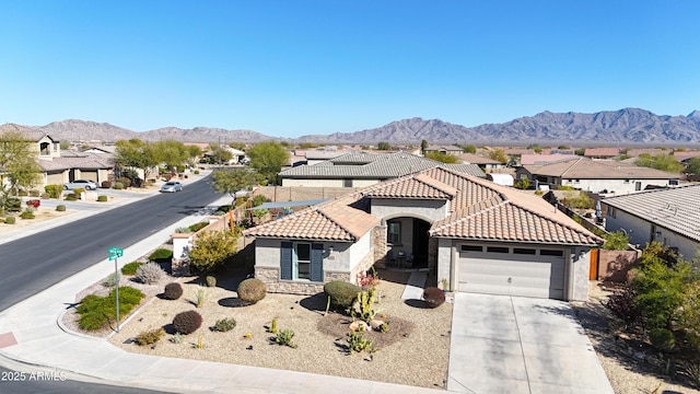 view of front of house featuring a mountain view and a garage