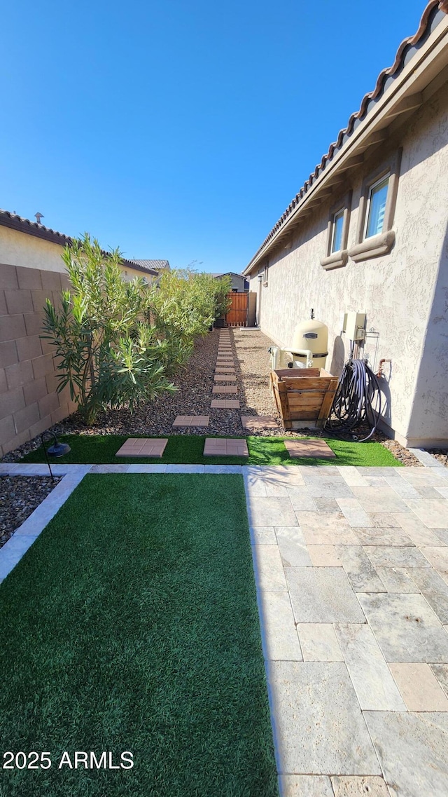 view of yard with a patio area