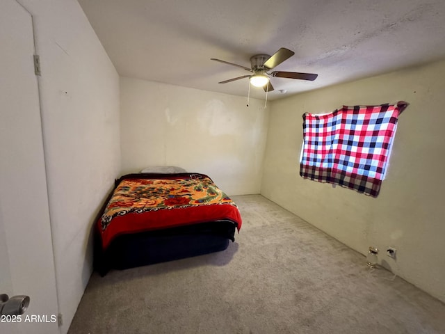 bedroom featuring light carpet and ceiling fan