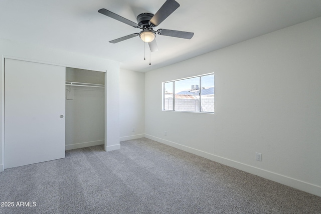unfurnished bedroom featuring ceiling fan, baseboards, a closet, and carpet