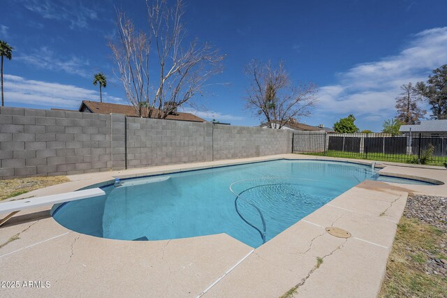 view of pool with a fenced backyard and a fenced in pool