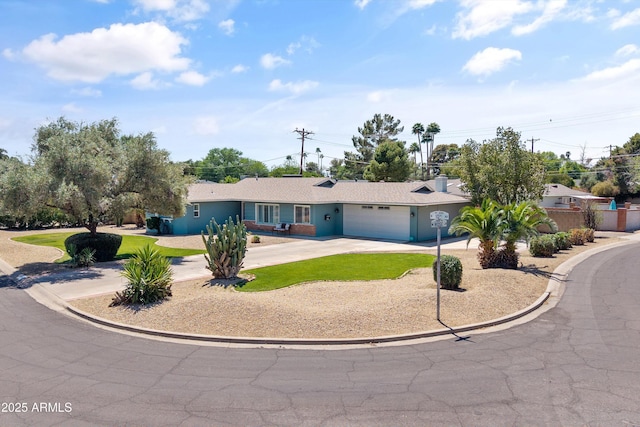 ranch-style house with fence, a garage, and concrete driveway