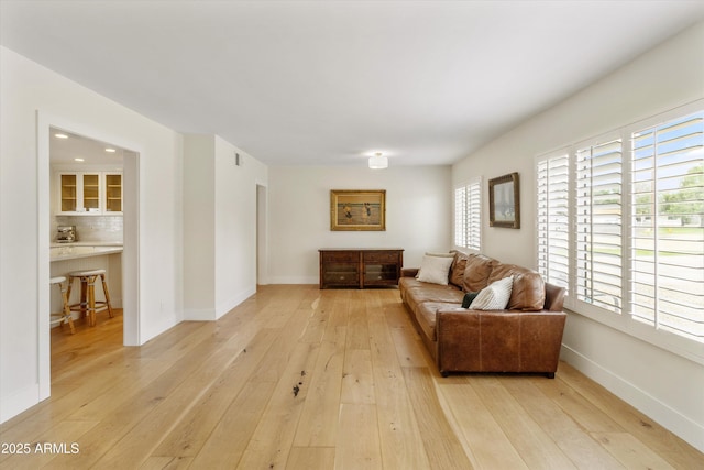 living room with light wood-style floors and baseboards