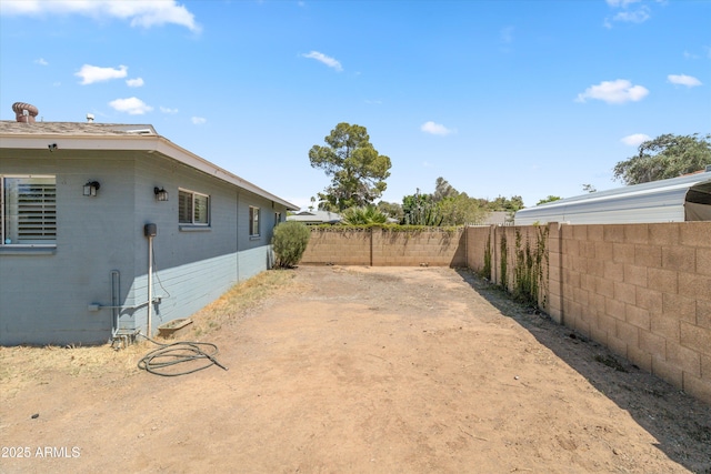 view of yard featuring a fenced backyard