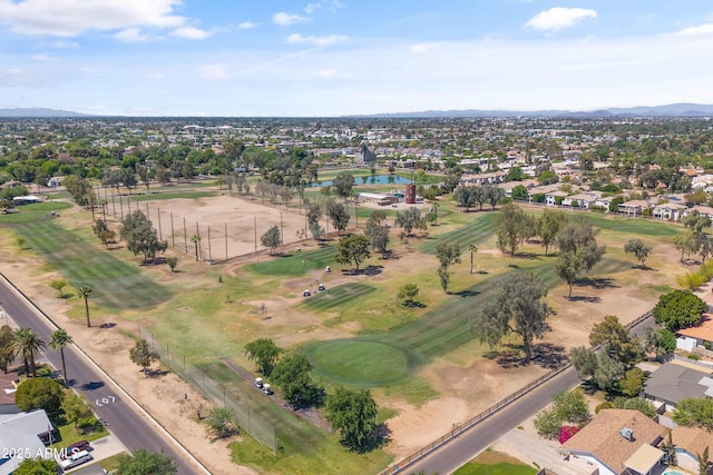 birds eye view of property featuring a water and mountain view, a residential view, and view of golf course