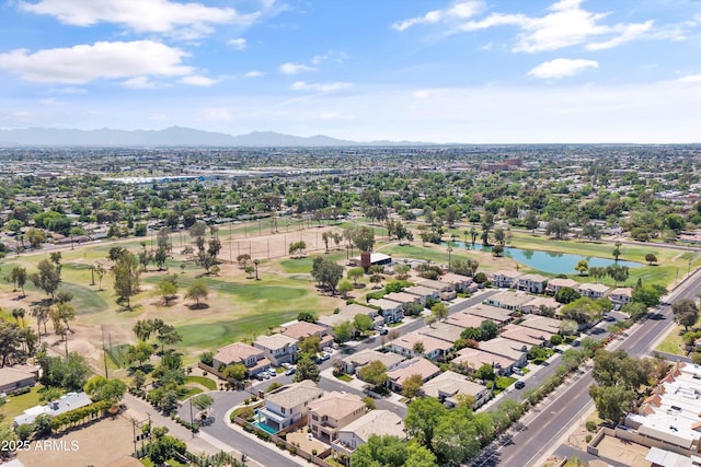 aerial view with a water and mountain view, a residential view, and view of golf course