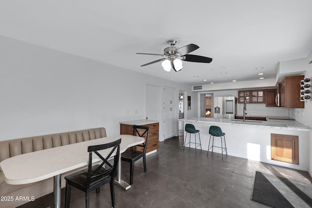 dining area with ceiling fan