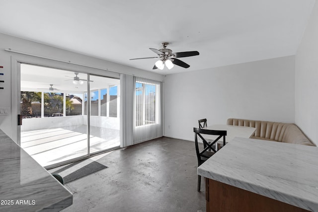 bedroom with concrete flooring, access to outside, and ceiling fan